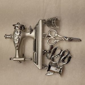 Oajc Silver tone sewing charm brooch.